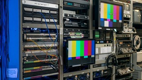 IMG distribution facility with media equipment racks and video monitors